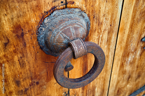 Obraz na plátně Vintage door knocker in the old wooden gate