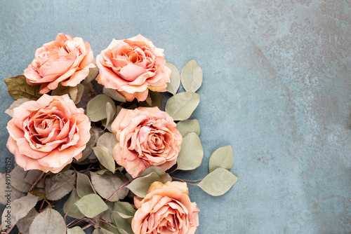 Flowers composition. Bouquet of pink roses in pastel colors. Flatlay.