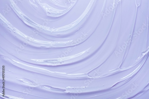 Liquid gel cosmetic smudge blue purple background photo