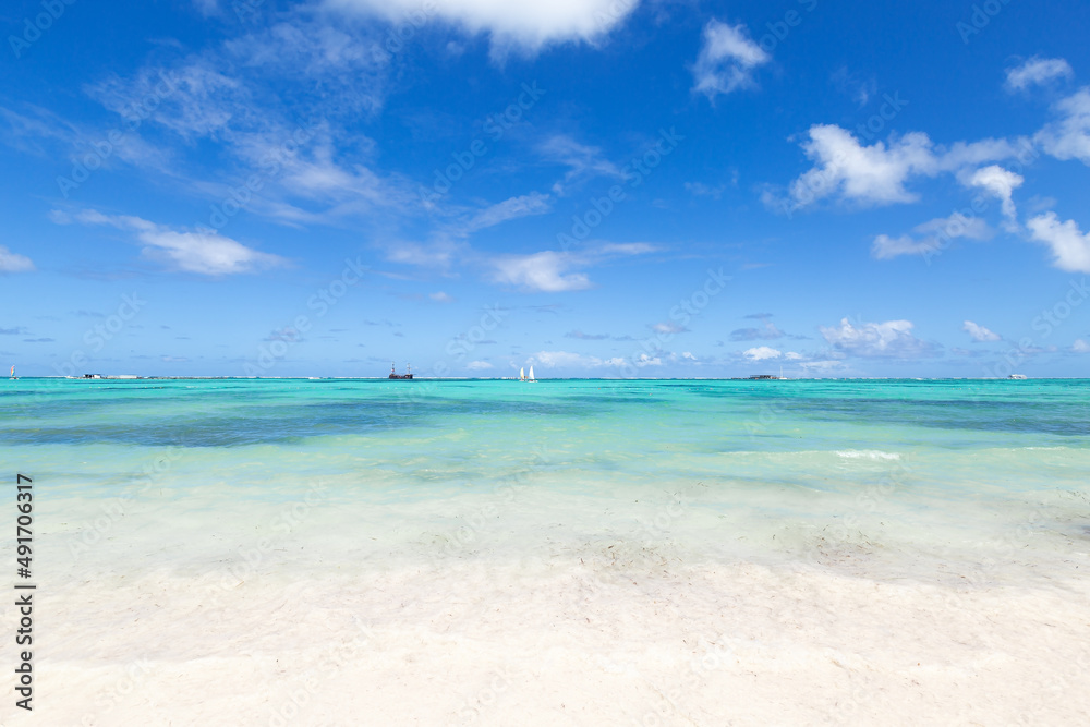 Bavaro beach in sunny day with calm ocean and white  beach, Dominican republic