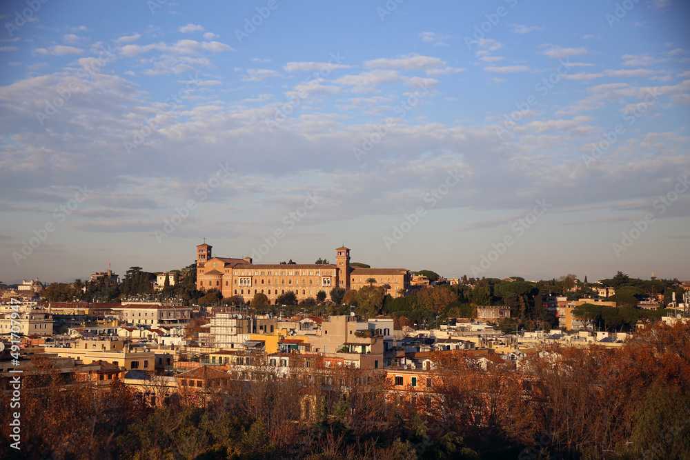 Panorama of the city of Rome from the Monte de 'Cocci, at sunset against the cloudy blue sky, Rome, Italy