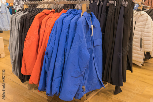 men's winter jackets on hangers in the store