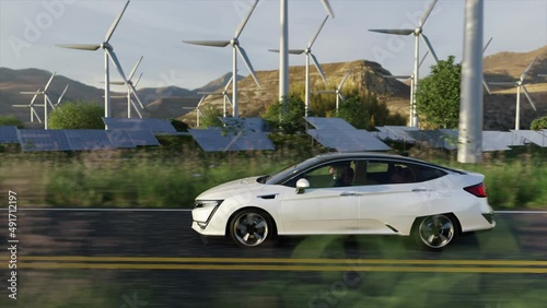 Electric Car Driving on the Road on  background of Windmills Turbine Farm and Solar Panels. 3D Realistic Animation. Self-driving Generic Auto. with Alternative Energy. Eco, Environment