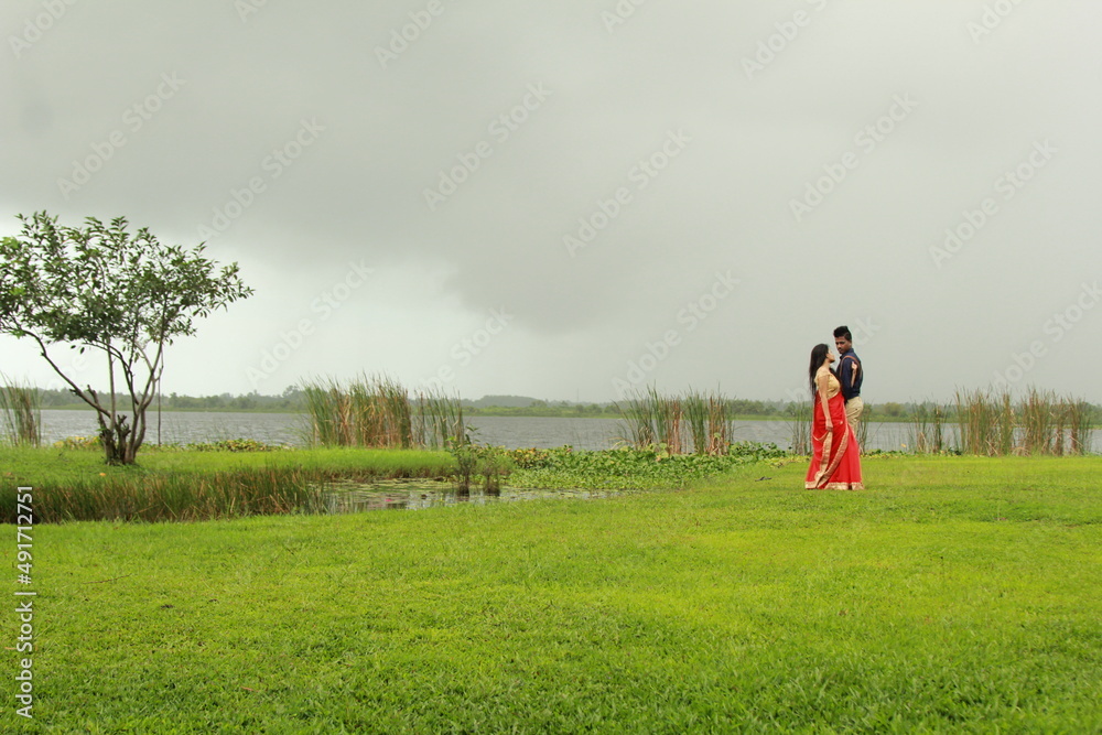 Fototapeta premium A beautiful moment with rainy weather. A loving couple looks at them
