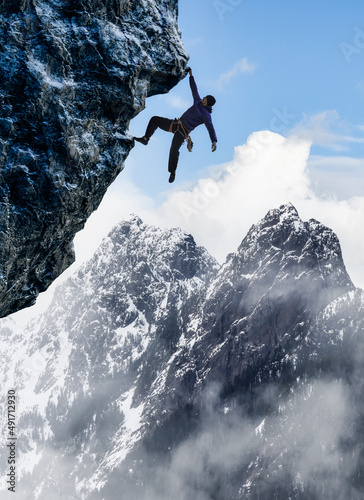 Adult adventurous man Rock Climbing a steep rocky cliff. Extreme adventure composite. 3d rendering mountain artwork. Aerial background landscape from British Columbia, Canada. Cloudy Sky