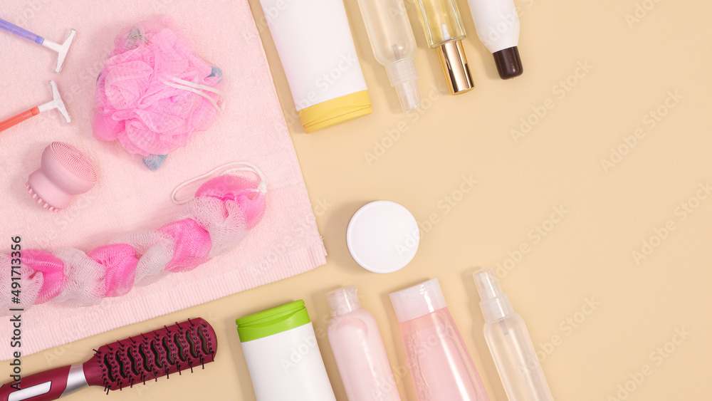 Creative copy space background with spa products and cosmetics on pastel beige theme. Flat lay. Creative copy space background with spa products and cosmetics on pastel beige theme. Flat lay.