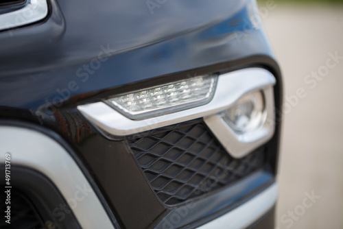 Headlight of a modern prestigious car close-up with modern optics