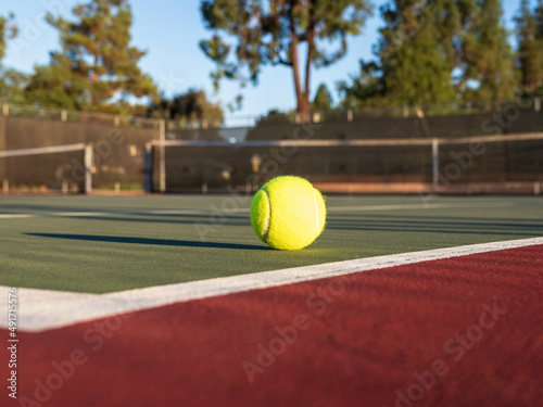 Yellow Tennis Ball on Green Center Court and Red Out of Bounds © Mark Roger Bailey