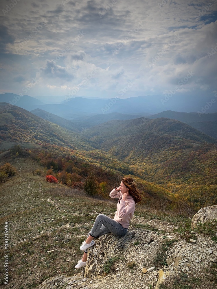 person on the top of a mountain