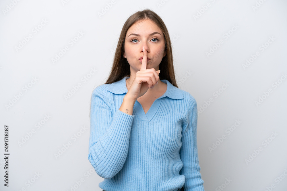 Young Lithuanian woman isolated on white background showing a sign of silence gesture putting finger in mouth Young Lithuanian woman isolated on white background showing a sign of silence gesture putting finger in mouth