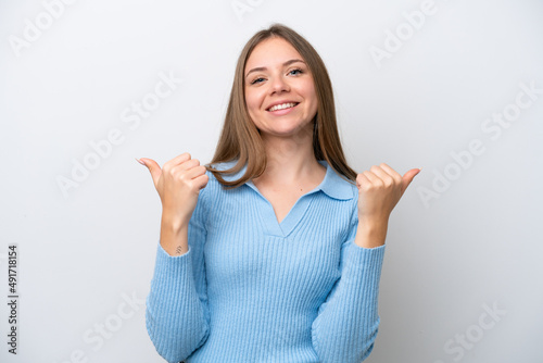 Young Lithuanian woman isolated on white background with thumbs up gesture and smiling © luismolinero