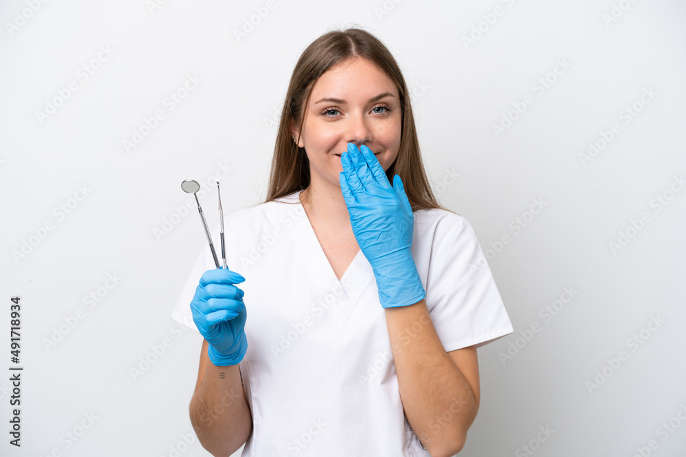 Dentist woman holding tools isolated on white background happy and smiling covering mouth with hand Dentist woman holding tools isolated on white background happy and smiling covering mouth with hand