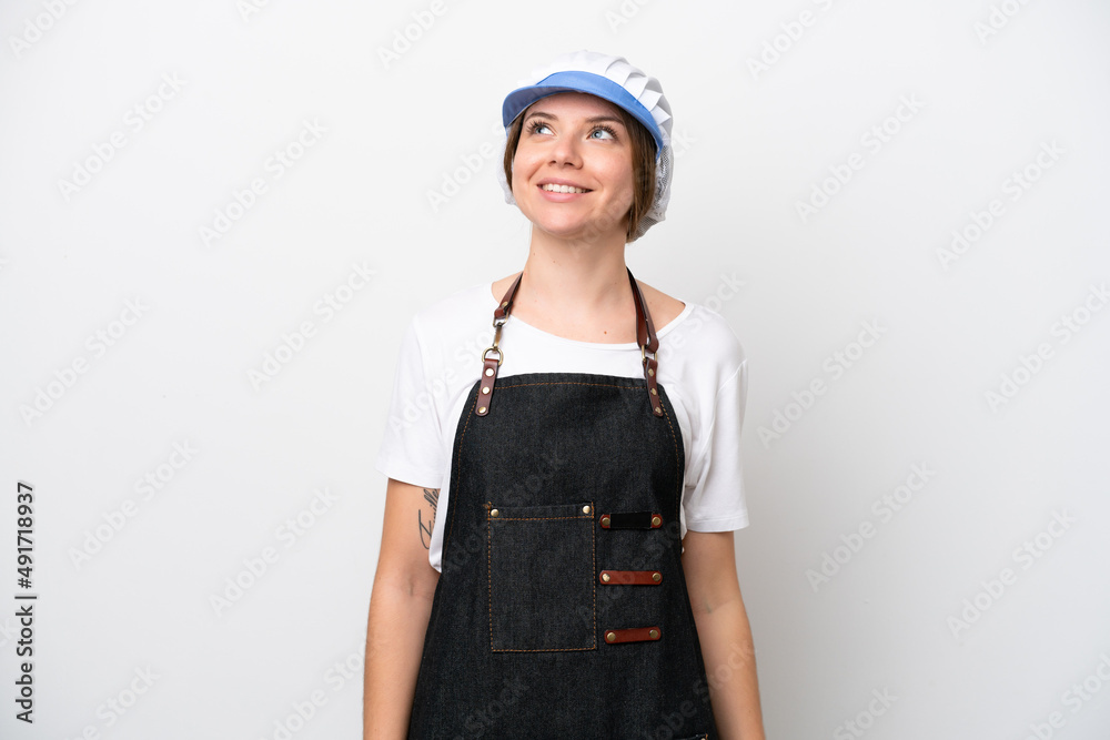 Fishmonger woman wearing an apron thinking an idea while looking up