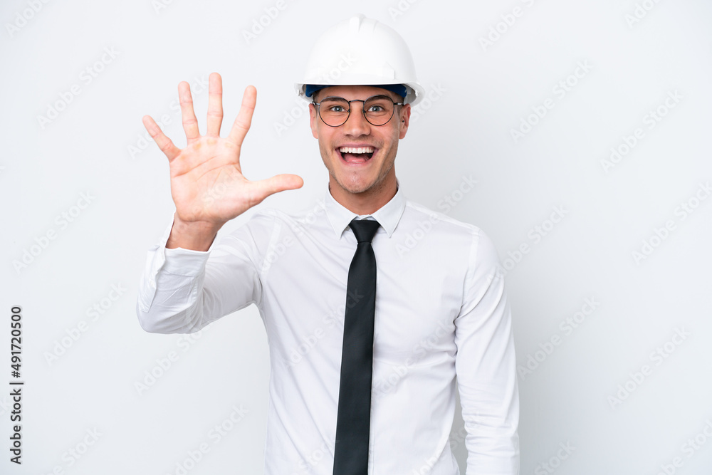 Young architect caucasian man with helmet and holding blueprints isolated on white background counting five with fingers Young architect caucasian man with helmet and holding blueprints isolated on white background counting five with fingers