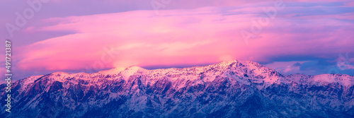 Photos Pink and purple sunset over snow-covered mountains near Salt Lake City, Utah