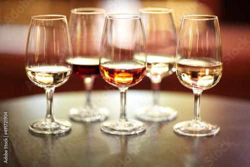 The many varieties of wine. Shot of five glasses of different wines on a table.