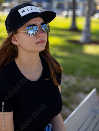 Young woman in a sporty dress at South Beach Miami - travel photography © 4kclips