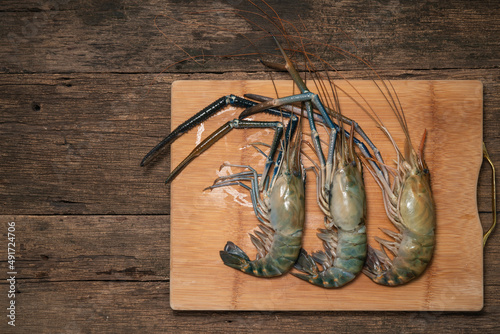 Fresh shrimp on on  a wooden background  Giant river prawn on  a wooden background.