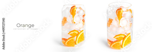 Orange drink with orange slices and ice in a glass isolated on a white background.