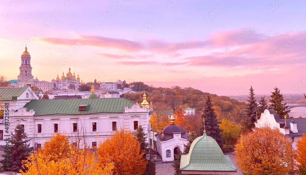 Lavra orthodox monastery in Kiev Ukraine, autumn season. Majestic landscape of ancient monastery, churches, cathedral, temples with golden domes. Christianity religion, spirituality, worship. 