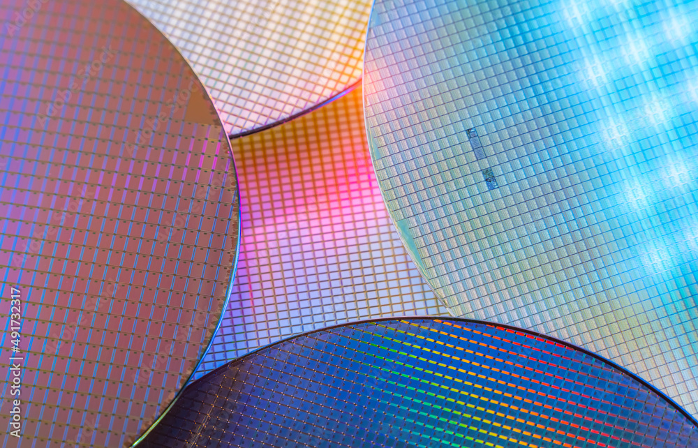Fototapeta premium Macro of silicon wafer semiconductor with neon color, integrated circuits to manufacture CPU and GPU