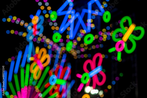 Blured Multi-colored neon lights at night.