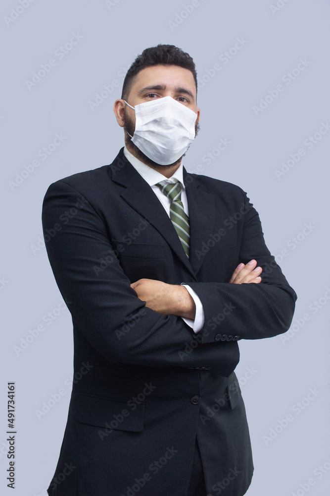 isolated businessman using mask to protect himself from viruses isolated businessman using mask to protect himself from viruses