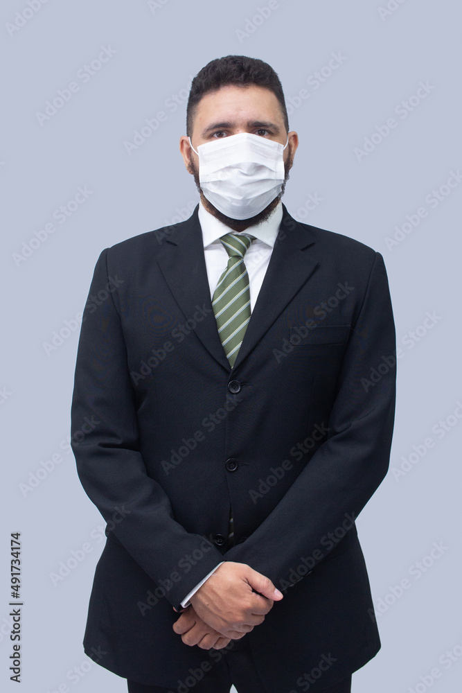 isolated businessman using mask to protect himself from viruses isolated businessman using mask to protect himself from viruses