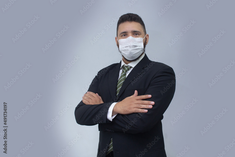 isolated businessman using mask to protect himself from viruses isolated businessman using mask to protect himself from viruses