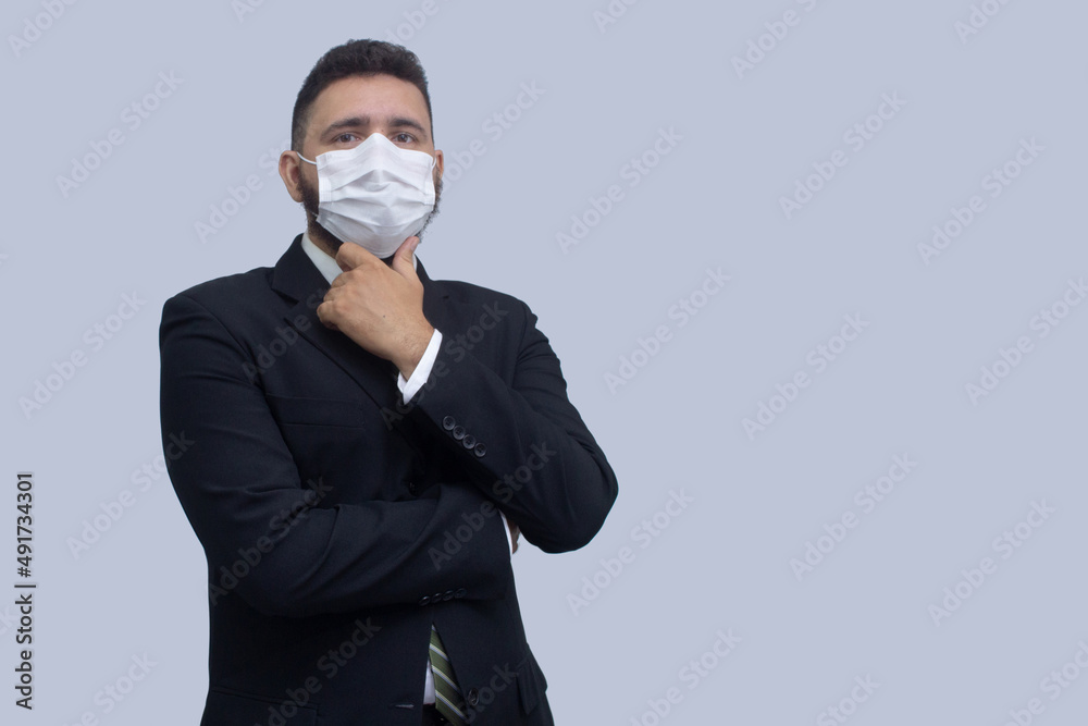 isolated businessman using mask to protect himself from viruses isolated businessman using mask to protect himself from viruses