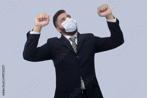 isolated businessman using mask to protect himself from viruses