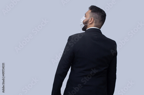 isolated businessman using mask to protect himself from viruses