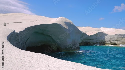 Sarakiniko Cliffs in slow motion on sunny summer day with no tourists on Milos island, Cyclades, Greece