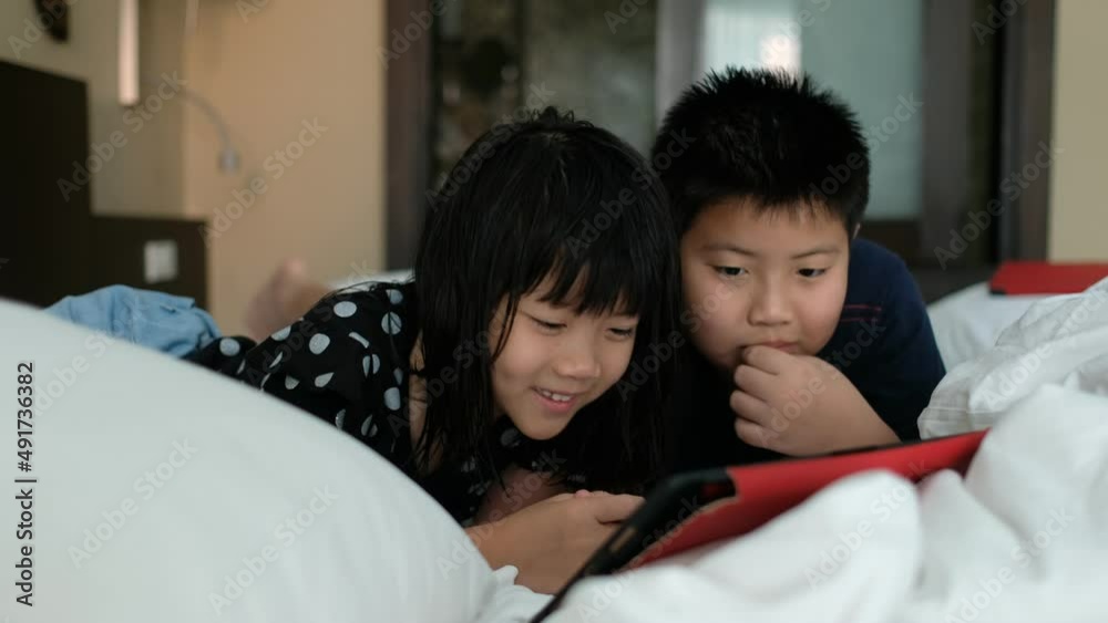 two children addicted tablet, asian kid watching cartoon
two children addicted tablet, asian kid watching cartoon