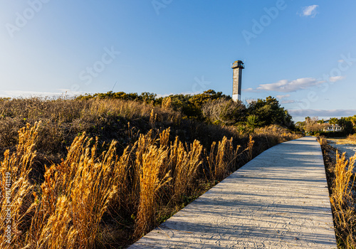 The Sand Dunes of Station 18 Beach and Sullivan's Island Lighthouse, Sullivan's Island, South Carolina, USA photo