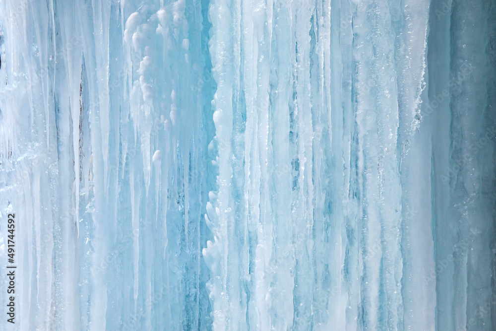 Icy, frozen textured icicle wall for background