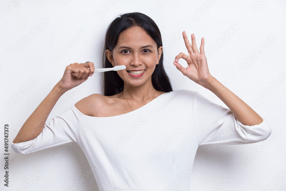 asian beautiful young woman suffering from toothache pain, tooth decay, tooth sensitivity; on white background
