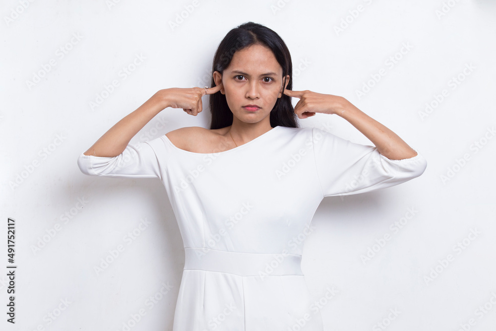 young asian beautiful woman covering both ears with hands isolated on white background
young asian beautiful woman covering both ears with hands isolated on white background