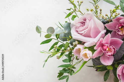 Decorative web banner made of beautiful pink peonies, rosies and eucalyptus isolated on white background. Feminine floral frame composition. Styled stock photo.
