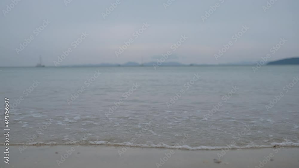 The sea wave on the beach on gloomy day The sea wave on the beach on gloomy day