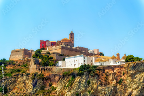 A view from the sea side to the Ibiza Old Town with Cathedral of Santa Maria d`Eivissa at the top of the hill in Ibiza, Spain.