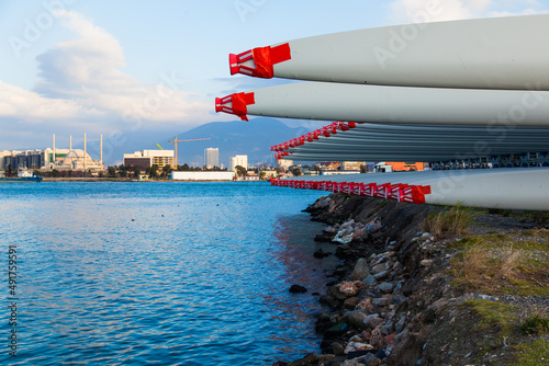 The blades of the wind stations are fixed and piled on the pier before departure from the city of Izmir Turkey.