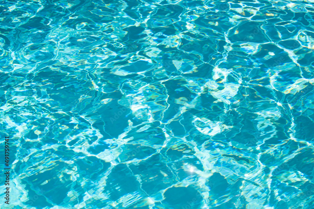 Water in swimming pool, background with high resolution. Wave abstract or rippled water texture.