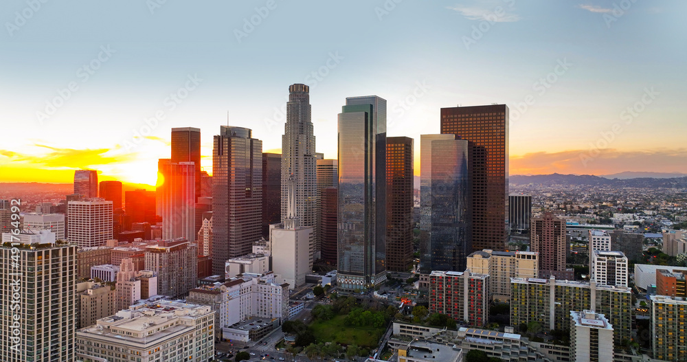 Urban aerial view of downtown Los Angeles. Panoramic city skyscrapers, downtown cityscape skyline at sunset.