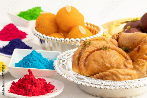 Gujia Mithai Also Called Gujiya, Pirukiya, Pirukia, Pedakiya, Karanji, Basundi Gughra Made Of Suji Ghee Stuffed With Mawa Khoya Chasni Mava Khoa With Gulal Abeer. Deepawali, Teez, Holi And Teej Theme photo