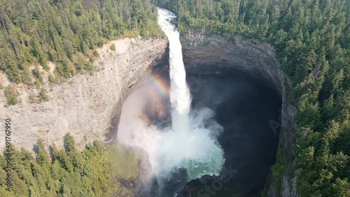 Powerful Helmcken Falls plunging into the Murtle RIver in British Columbia, Canada. Wide angle aerial pull back shot photo