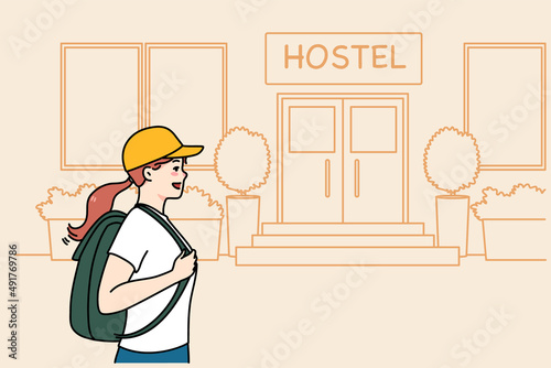 Happy woman tourist with backpack go to hostel for night accommodation. Smiling female traveler walk to hotel entrance. Travel and tourism concept. Flat vector illustration. 