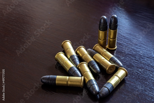 Bullets on the table. Ammunition. Concept of crime