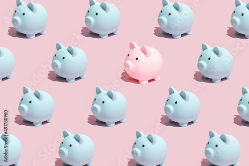 Seamless pattern made of pastel blue and pink piggy banks on pink background. Concept of saving  accumulating and preserving money. Break the pattern.