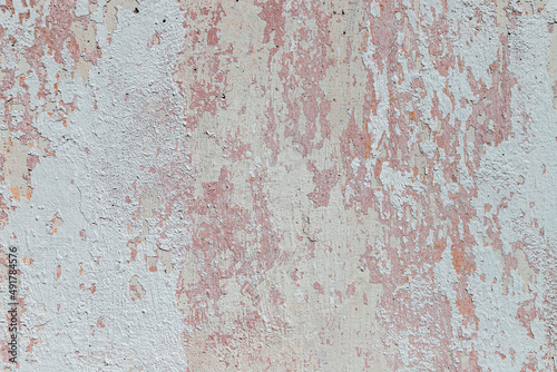Peeling whitewash on a plaster wall © TasiPas